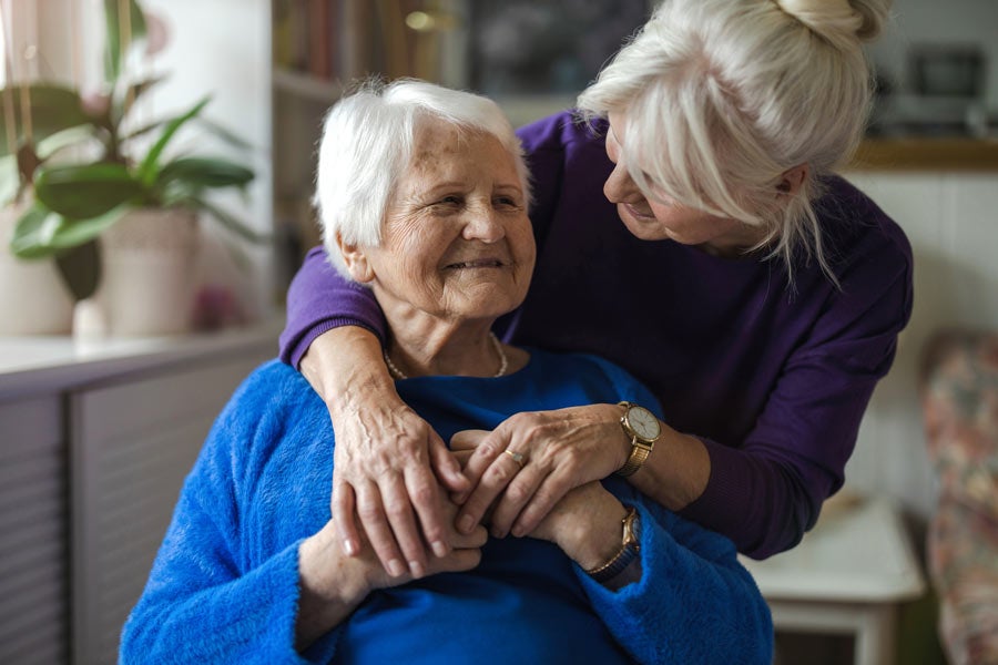 Senior woman getting support from a friend